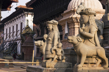 close up on stoned carved statue the ruins left after massive earthquake at Bhaktapur durbar square with copy space