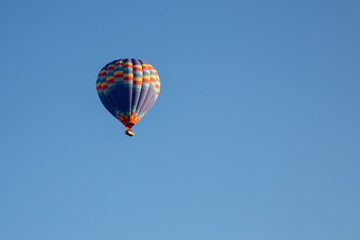 Hot air balloon flying over spectacular Cappadocia