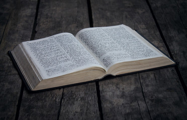 Bible on a wooden desk.