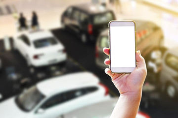 Searching for buy a new car with hand holding smart phone of concept