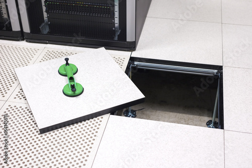 Lifted Datacenter Floor Tile With Vacuum Suction Cups In Lifted Datacenter Floor Tile With Vacuum Suction Cups In