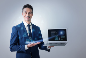 Cheerful elegant man is showing diagram