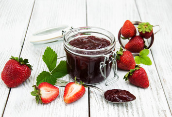 Strawberry jam and fresh strawberries