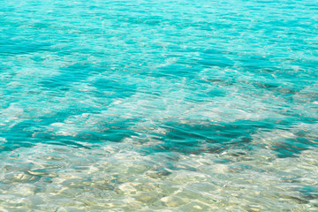 Fototapeta na wymiar Beautiful light blue seashore, italian beach in Salento, natural marine background, transparent sea