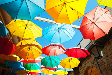 Fototapeta na wymiar Colorful umbrellas on the street in Limassol, Cyprus