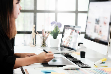 Graphic designer woman working on creative office with create graphic on computer.