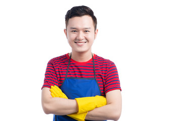 Handsome smiling asian man doing housework. Isolated over white.