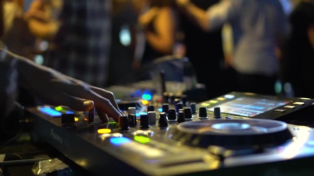BANGKOK, THAILAND April 20, 2017: Hands of DJ which mixes music.