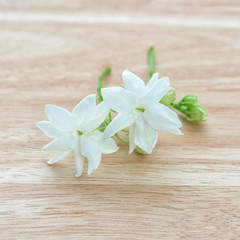 Fototapeta na wymiar Close-up Jasmine flowers on a wood table