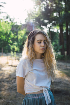 Girl with closed eyes posing on nature