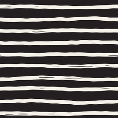 Decorative seamless pattern with handdrawn doodle lines. Hand painted grungy wavy stripes background. Trendy freehand texture