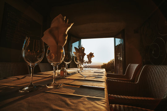 Served table with wineglasses with napkins