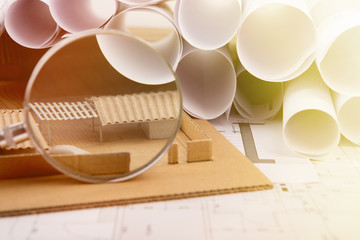 Workplace of architect - construction drawings, scale model and tools