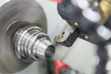 CNC lathe machine (Turning machine) cutting the metal  screw thread part .Hi-precision CNC machining concept.