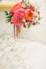 Beautiful decoration on wedding table with roses in bouquet