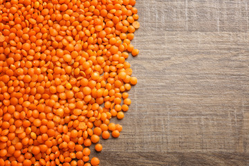 Heap of red lentils on  table