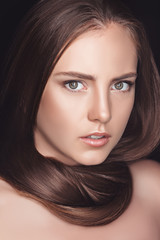 Fototapeta premium portrait of beautiful young caucasian woman with long hair