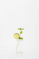 homemade refreshing drink with lime and mint twig isolated on white