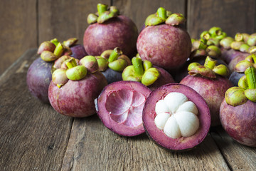 Mangosteen fruit on wood table brown with old