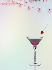Cocktail drink with cherry. Red. Blurry party style background.