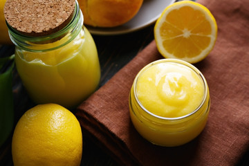 Beautiful composition with delicious lemon curd on table