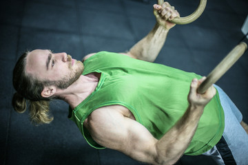 Attractive fit man working out at the gym.