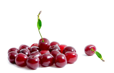 Fresh cherries isolated on white background. One cherry lies separately from the other cherries. Summer berries. Healthy food. Bright photo with copyspace.