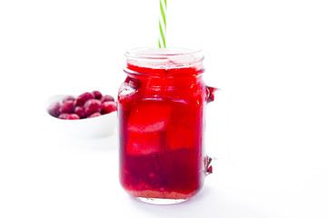 Summer iced drink - tea or juice with ice and berries