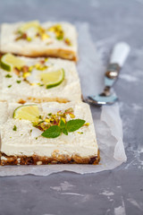 Raw pistachio, coconut and lime cheesecakes. Love for a healthy vegan food concept.