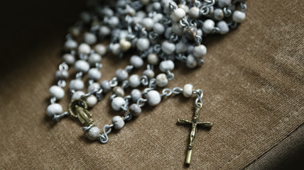 Third rosary with crucifix and image of Catholic devotion