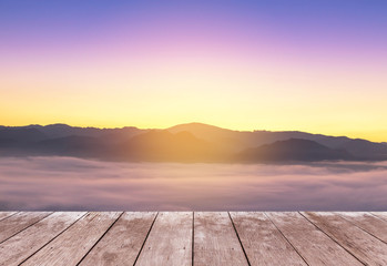 Fototapeta na wymiar Empty old wooden balcony terrace floor on viewpoint high tropical layer mountain with white fog in early morning