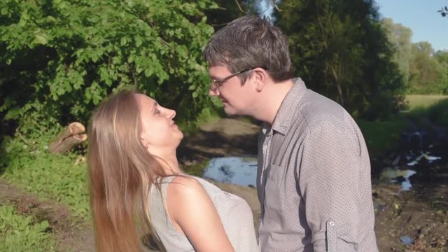 Guy and girl embrace and kiss, swear and fight, scandal in relationships