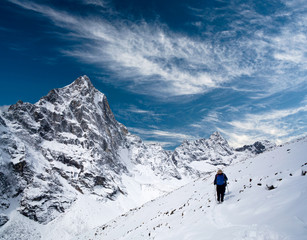 Fototapeta na wymiar An unidentified hiker walking on the road to Everest Base Camp in Sagarmatha National Park, Nepal Himalaya