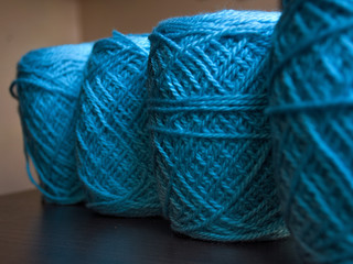 Blue thread crochet on a dark background
