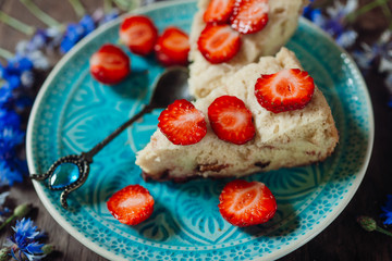 Pie with strawberry on blue plate
