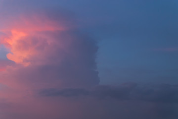 Fototapeta premium Color through clouds in the evening sky.