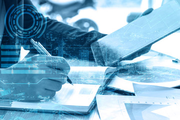 double exposure businessman writes business plan with tablet