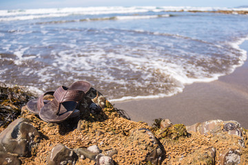 Sandles by the surf