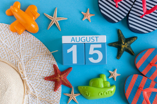 August 15th. Image of August 15 calendar with summer beach accessories and traveler outfit on background. Summer day, Vacation concept