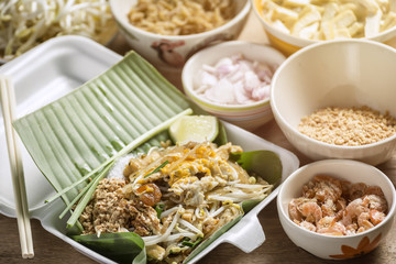 Pad-Thai Food of Thailand for Take home Arrange on a wooden table.