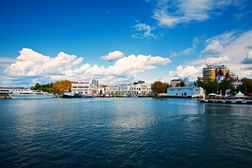 Naklejka premium Marina of Sochi city, Russia. Blue water and sky clouds on the horizon