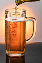 Beer is poured into a mug