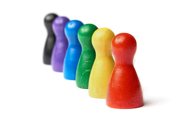 Game figures standing behind the other. Colorful game figures. Concept for homosexuality, gay marriage, diversity and tolerance.