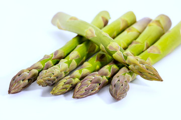 Fresh green asparagus spears on white background.