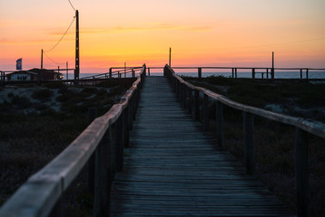 Fototapeta na wymiar Wood piers and sea and sunset