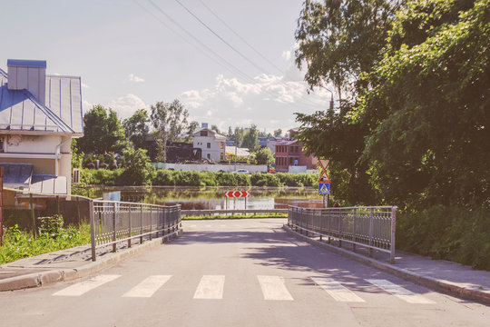 old town street road and a river in summer vologda, russia