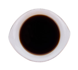 Bowl with soy sauce isolated on white background