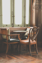 Vintage tables and three chairs in restaurant