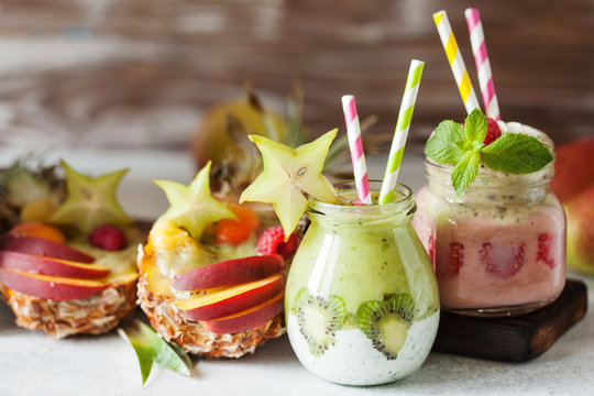 Layered berry and chia seeds smoothies and exotic fruit salad