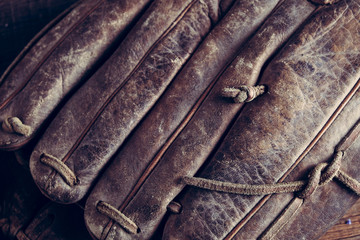 old Baseball and glove on wood background with filter effect retro vintage style